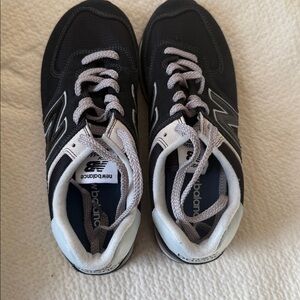 New Balance classic 574. Worn only once in women’s size 8 wide